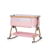 Chipolino Co-sleeping crib with drop side “Charisma" powder pink/wood + wheels KOSCA0265PP
